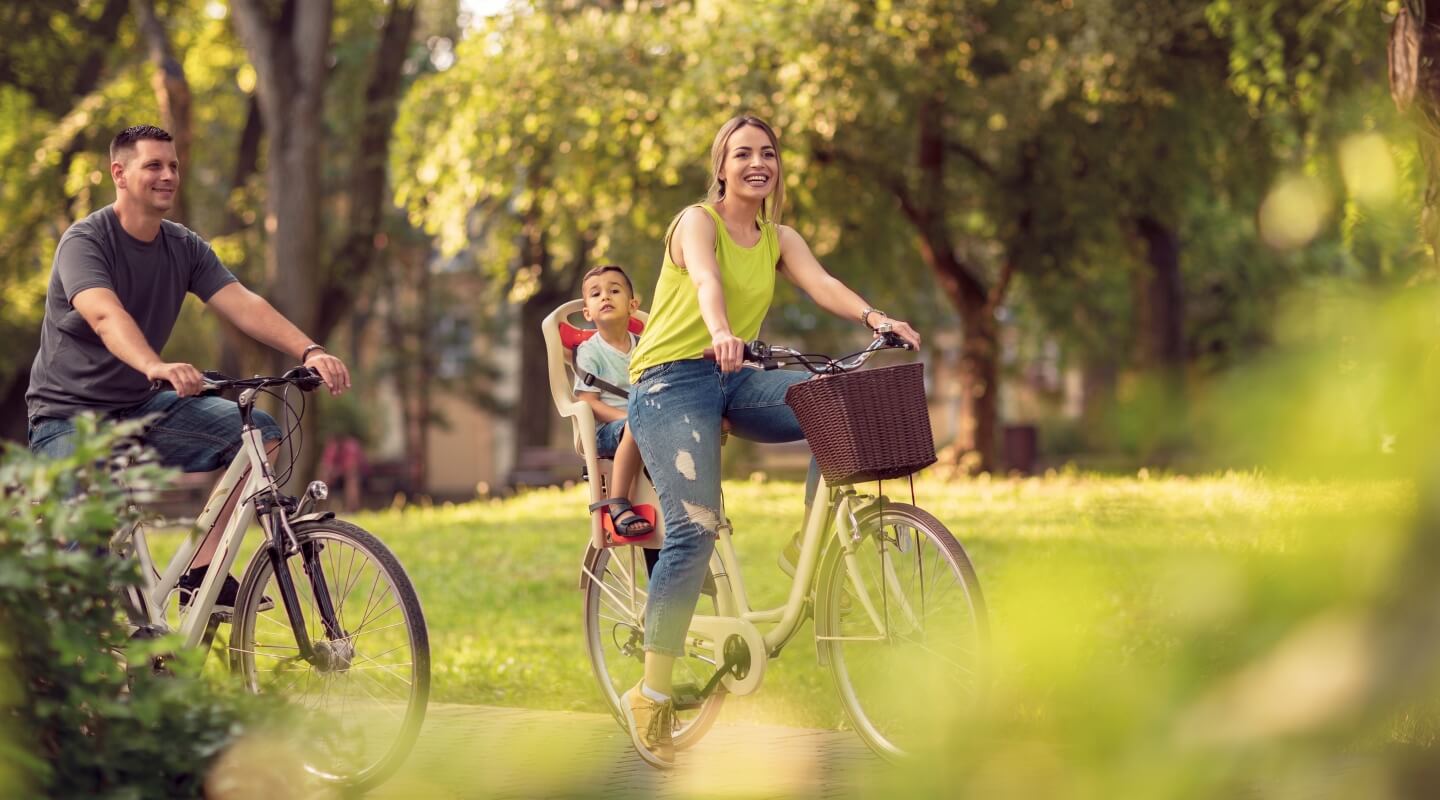 a family of 3 biking